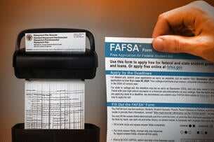 Person holding a FAFSA form in front of a shredder.