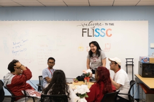 A group of students sit and chat in a circle at Stanford University's center for first-generation, low-income students