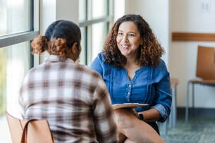 College-age woman receives counseling on campus