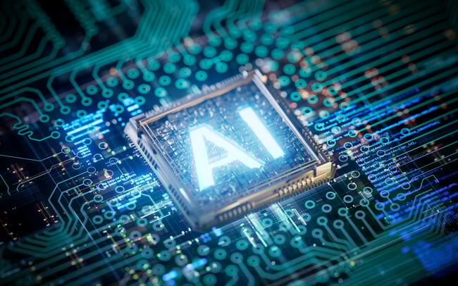The letters "AI" are lit up on a circuit board.