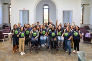 Faculty and staff at the University of Notre Dame wear their first-generation T-shirts