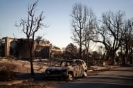 Burned car and neighborhood