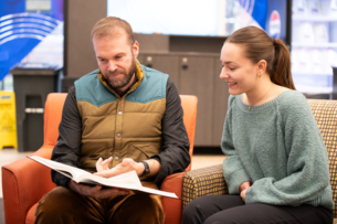 A student and professor meet to discuss the student's career goals at the University of Dayton.